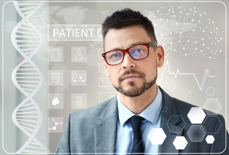 Man with electronic patient record on gray background. Innovative technologies in medicineの写真素材