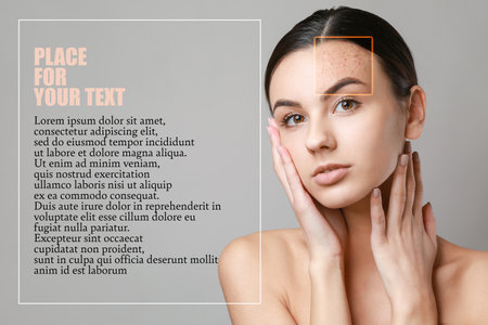Young woman with problem skin and space for text on gray backgroundの写真素材