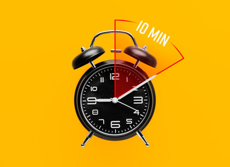 Alarm clock with timer for 10 minutes on color background. Time management concept