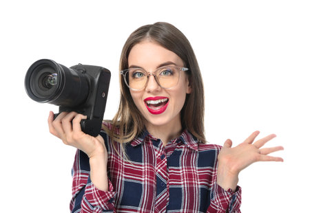 Young female photographer on white background