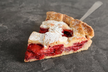 Piece of tasty strawberry pie on grunge backgroundの写真素材