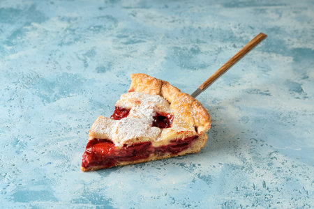 Piece of tasty strawberry pie on color backgroundの写真素材