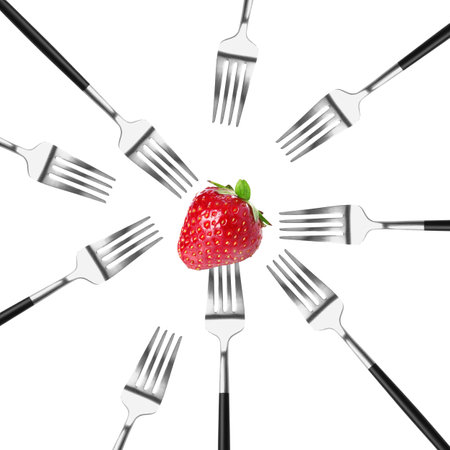 Many forks and ripe strawberry on white backgroundの写真素材
