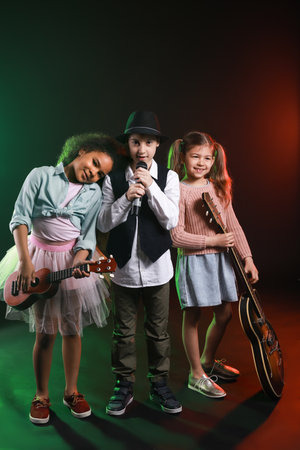 Band of little musicians on dark backgroundの写真素材