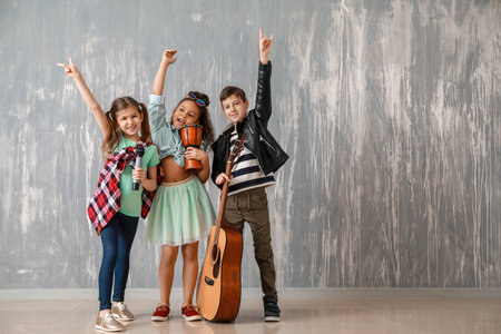 Band of little musicians against grunge wallの写真素材