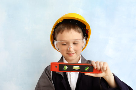 Cute little builder on color backgroundの写真素材