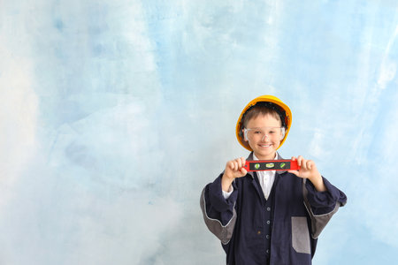 Cute little builder on color backgroundの写真素材