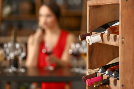 Shelf with bottles in wine cellarの写真素材