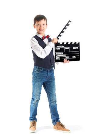 Little boy with clapperboard on white backgroundの写真素材