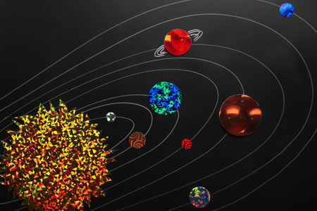 Creative planetary system on dark background