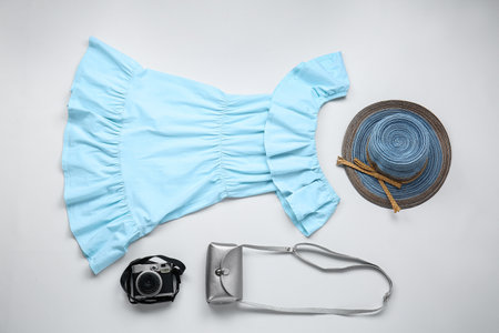 Set of female clothes, accessories and photo camera on white backgroundの写真素材