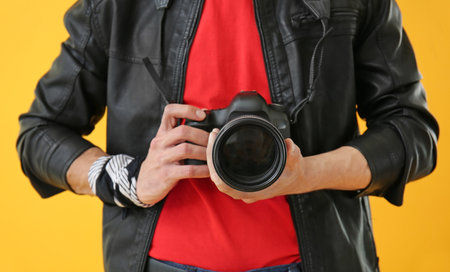 Male photographer on color background, closeupの写真素材