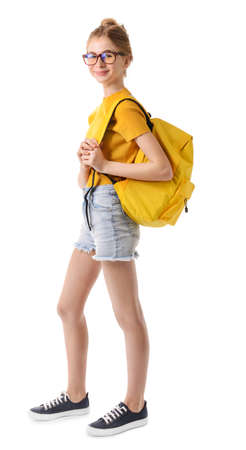 Cute teenage girl with backpack on white background