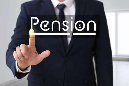 Young businessman with word PENSION indoorsの写真素材