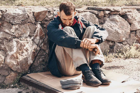 Poor homeless man outdoorsの写真素材