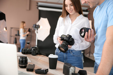 Professional photographers in modern studio