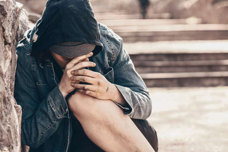 Poor homeless woman outdoorsの写真素材