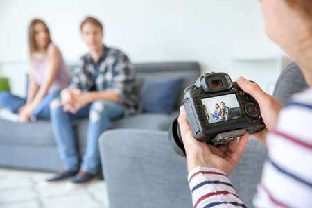 Professional photographer working with models in studio