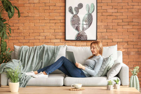 Portrait of mature woman working on laptop at home