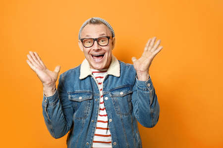 Happy middle-aged man on color background