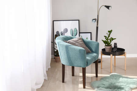Light curtains with stylish furniture in interior of room