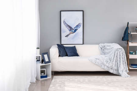 Light curtains with stylish furniture in interior of room