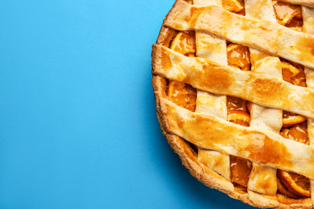 Tasty orange pie on color backgroundの写真素材