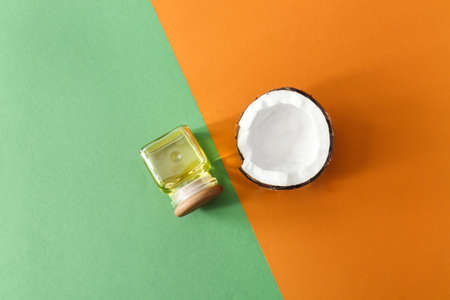 Composition with coconut oil on color background