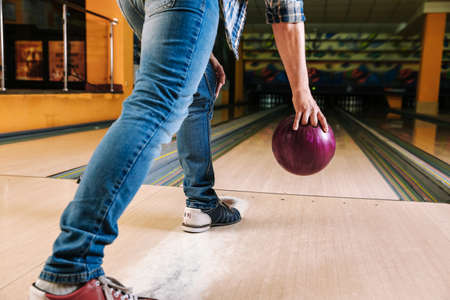 Man playing bowling in clubの写真素材