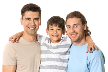 Happy gay couple with adopted child on white backgroundの写真素材