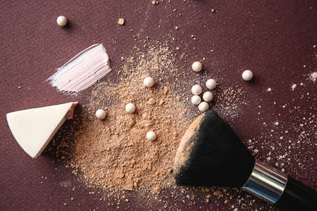 Cosmetic products with brush on color background