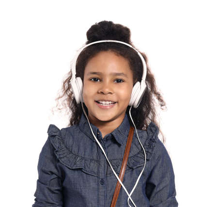 African-American girl listening to music on white background