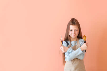 Cute little artist on color backgroundの写真素材