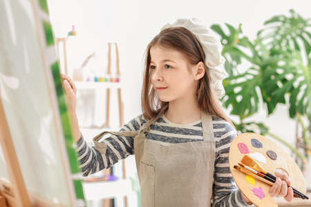 Cute little artist in studio