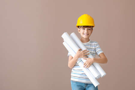 Cute little architect on color backgroundの写真素材