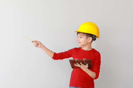Cute little foreman on light backgroundの写真素材