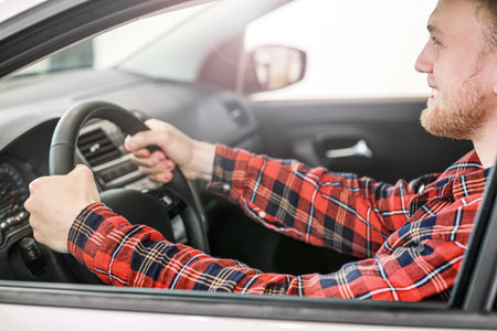 Man choosing new car in salonの写真素材
