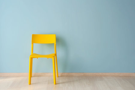 Chair near color wall in roomの写真素材