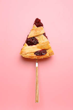 Piece of tasty cherry pie on color background