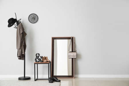 Stylish interior of hall near light wallの写真素材