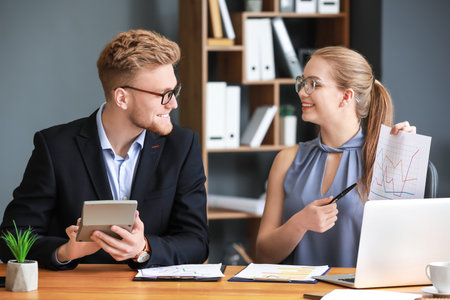 Male and female accountants working in officeの写真素材
