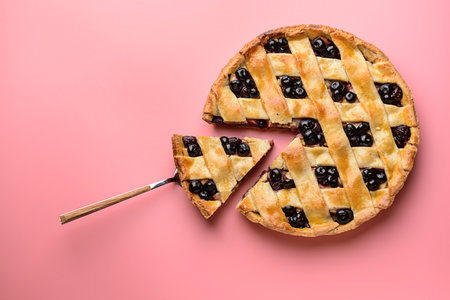 Tasty blueberry pie on color backgroundの写真素材