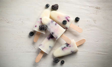 Tasty berry ice cream on white background