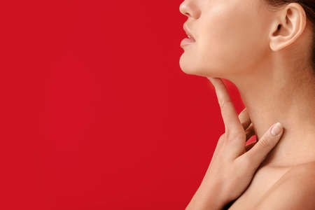 Beautiful young woman on color backgroundの写真素材