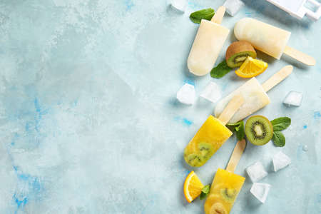 Tasty fruit ice cream on color background