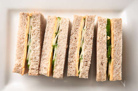 Tasty cucumber sandwiches on plate, top viewの写真素材