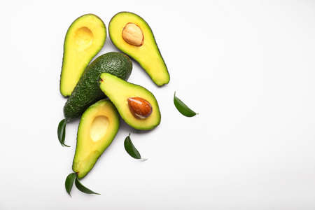 Cut fresh avocado on white backgroundの写真素材