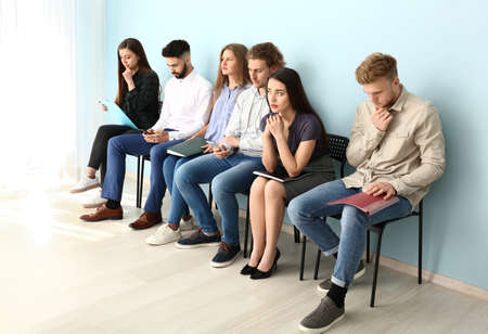 Young people waiting for job interview indoorsの写真素材