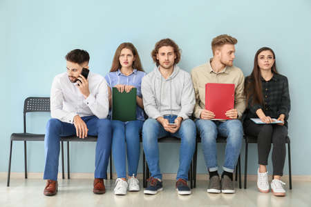 Young people waiting for job interview indoorsの写真素材