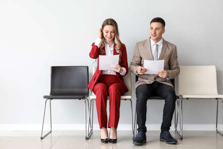 Young people waiting for job interview indoorsの写真素材